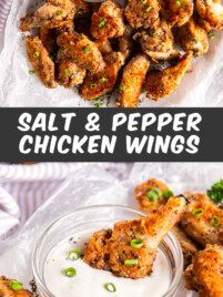 Salt and pepper chicken wings sit on a white serving plate with a small bowl of dipping sauce.