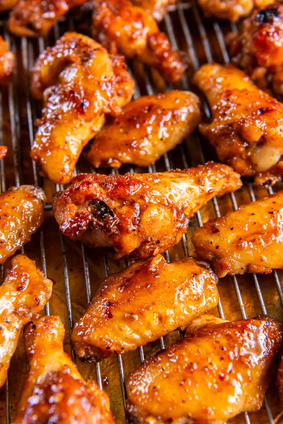 Baked Hot Honey Chicken Wings on a baking sheet after baking in the oven. 