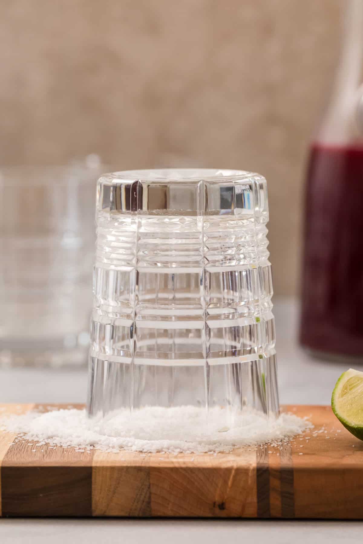 Salting the rim of a glass with salt.