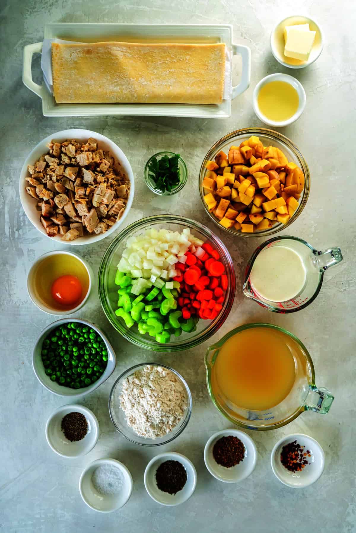 Ingredients for chicken pot pie set out on a counter