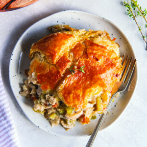 A plate of chicken pot pie with a fork