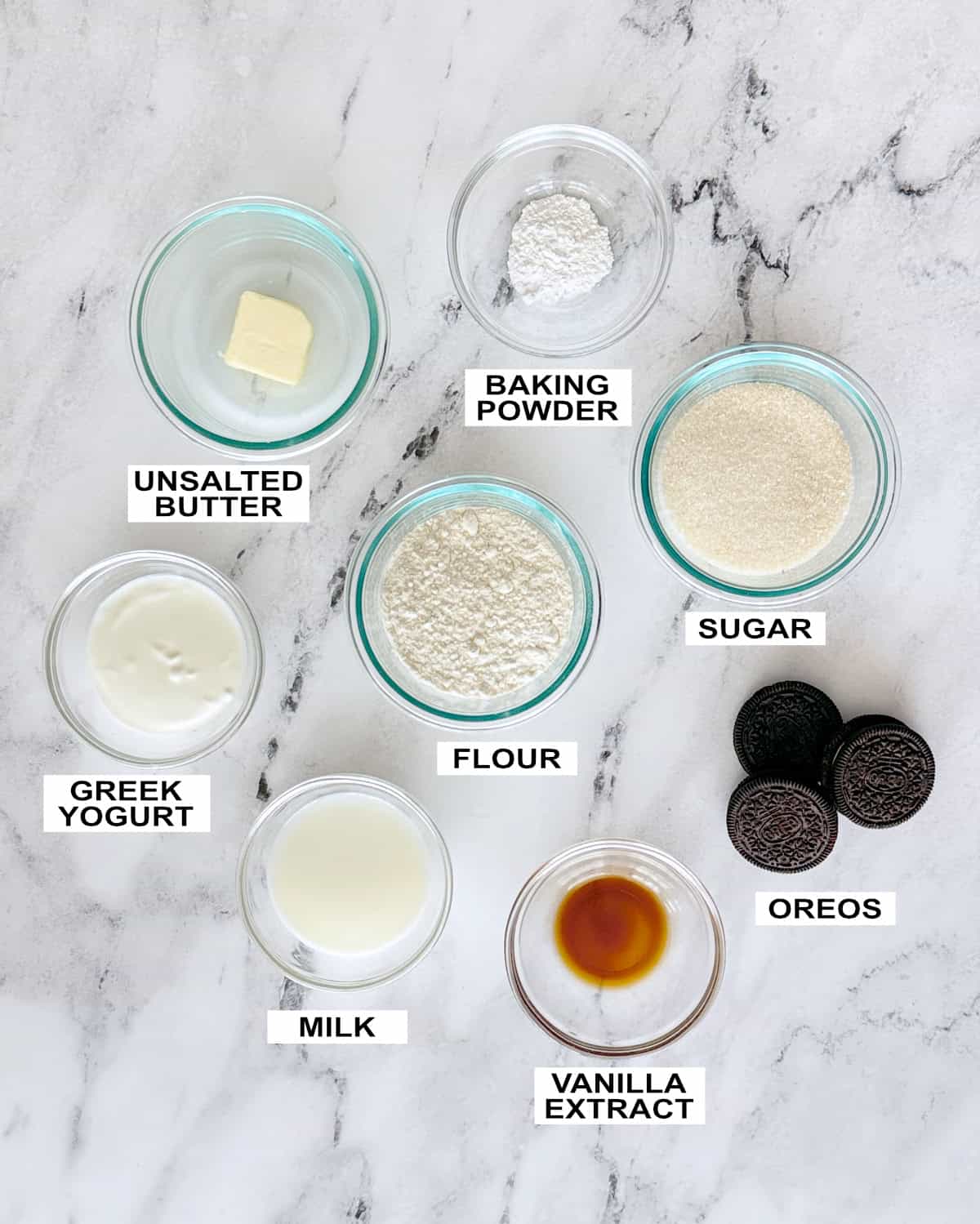 Ingredients for a cake in a mug set out on a counter